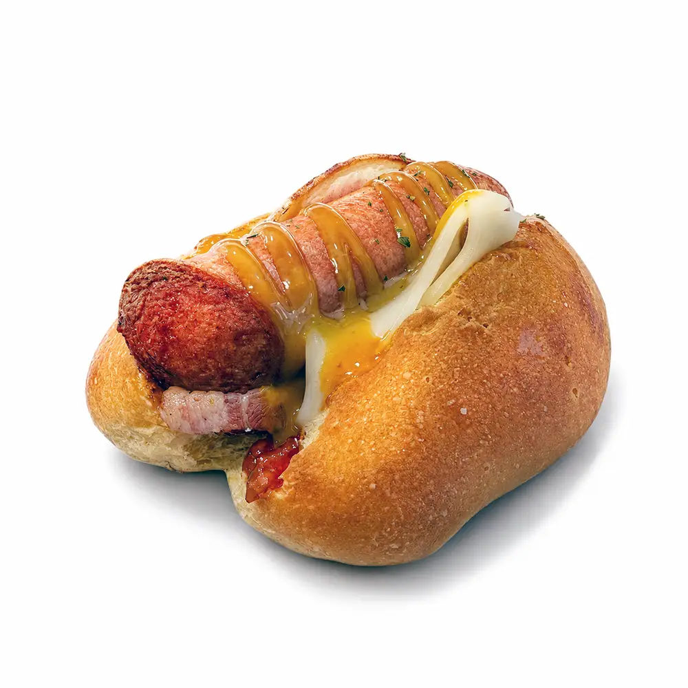 Perrito caliente con salchicha, queso fundido y salsa de Valumé Catering